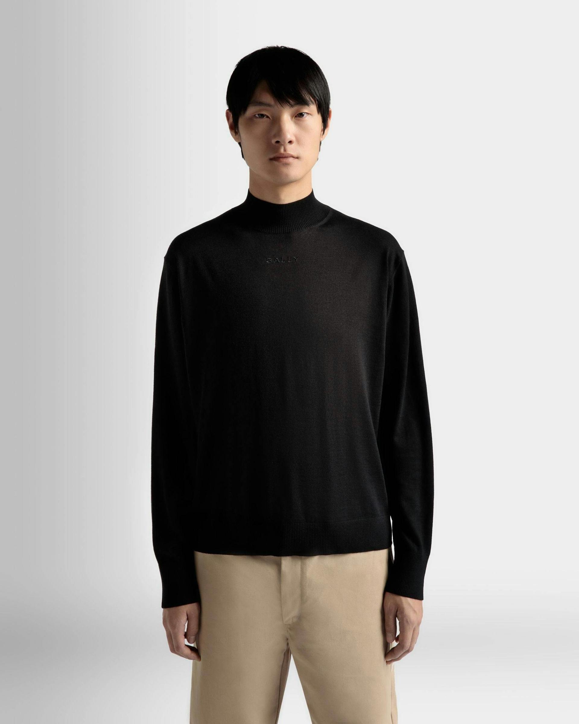 Men's Roll Neck Sweater in Black Wool | Bally | On Model Close Up
