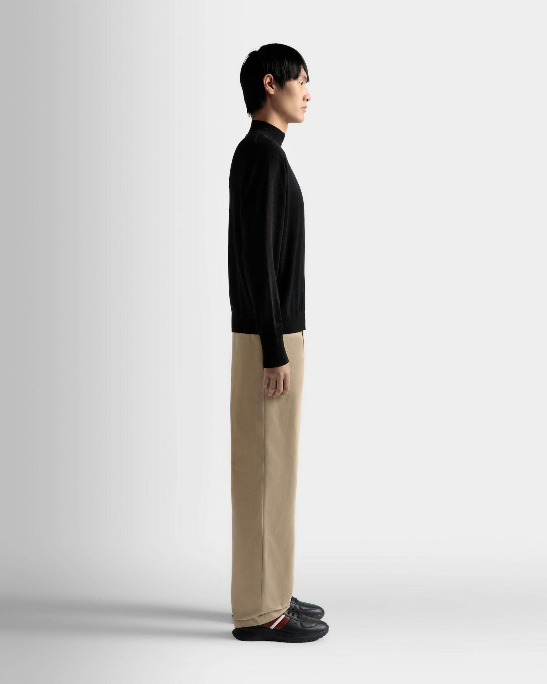 Men's Roll Neck Sweater in Black Wool | Bally | On Model 3/4 Front